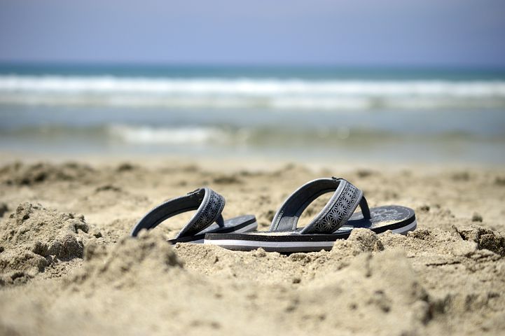 sandals on a sandy beach